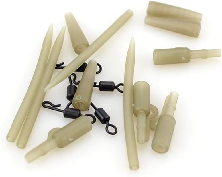 Load image into Gallery viewer, Ontdek de ultieme set voor het karpervissen voor een succesvolle vangst met deze collectie beige veiligheidsloodclips en zwarte wartels, willekeurig gerangschikt op een witte achtergrond.
