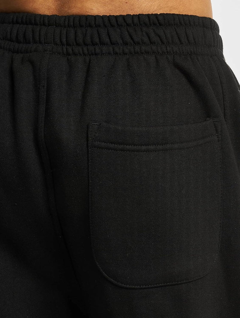 Laad afbeelding in Galerijviewer, Close-up van de Comfortabele en stijlvolle joggingbroek voor heren, met een zwarte zak en elastische tailleband, perfect voor dagelijks gebruik.
