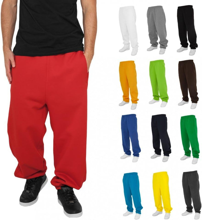Laad afbeelding in Galerijviewer, Het dragen van loszittende rode joggingbroeken en zwarte schoenen geeft een relaxte uitstraling. Rechts toont een display van Comfortabele en stijlvolle joggingbroeken voor heren in verschillende kleuren hun veelzijdigheid voor elk casual uitje.
