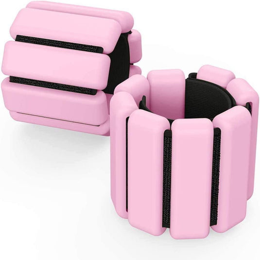 Deze roze verstelbare pols- of enkelgewichten met zwarte elastische banden zijn perfect voor fitnessliefhebbers die op zoek zijn naar een intensieve workout, en helpen om tijdens weerstandssessies efficiënt sterke spieren op te bouwen. Verbeter uw training met 