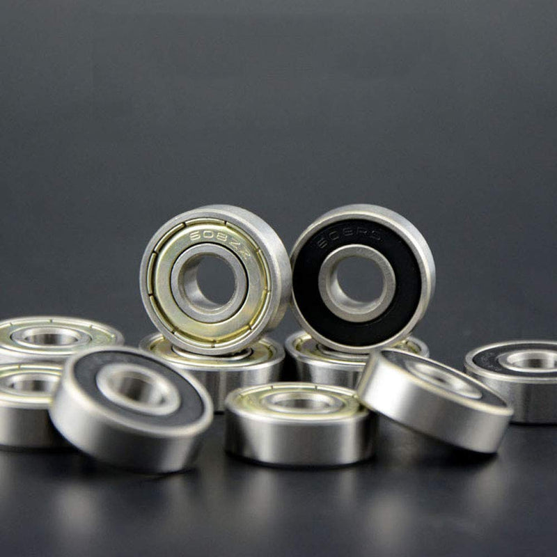 Laad afbeelding in Galerijviewer, Een close-up van verschillende metalen kogellagers, waaronder koolstofstalen lagers met zwarte binnenringen, rustend op een donkere ondergrond. Deze &quot;Optimaliseer je skateboardprestaties met onze hoogwaardige skateboardlagers - 30 stuks&quot; beloven soepele prestaties met hun strakke metallic afwerkingen.
